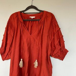 Orange short sleave blouse with tassles